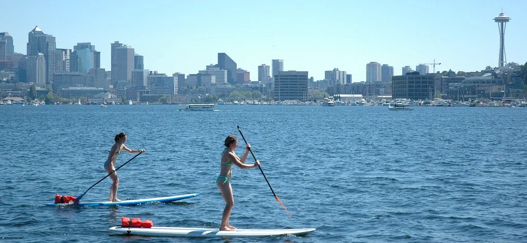 First Time Homeowner Checklist: What You Need to Know first time out for two women stand up paddle boarding on a sunny day, lake union, space needle, south lake union view, gas works park, seattle, washington, usa