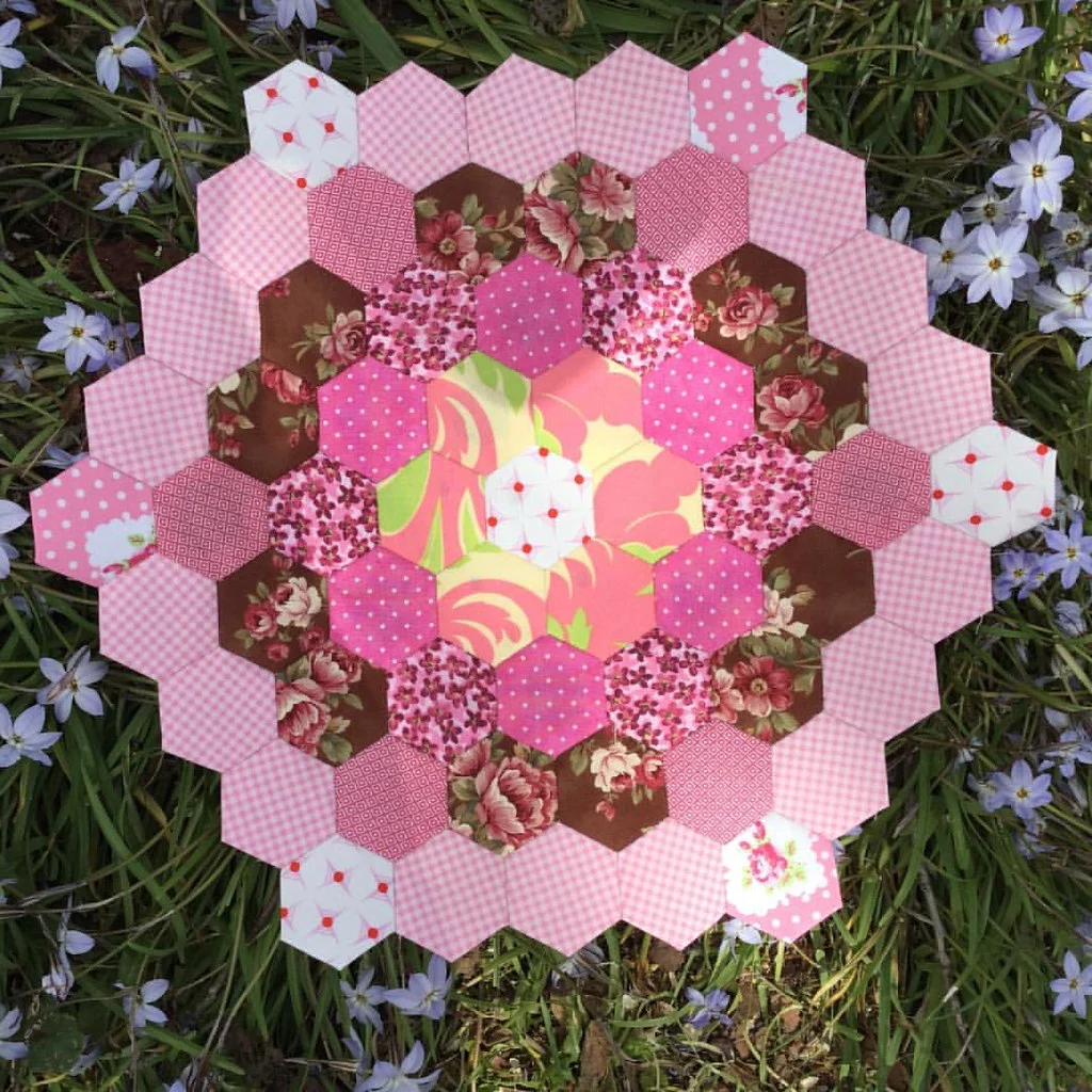 it keeps growing and i'm now wondering if i should use another shape like a diamonds but where from there? #pep #englishpaperpiecing #hexies #hexagons