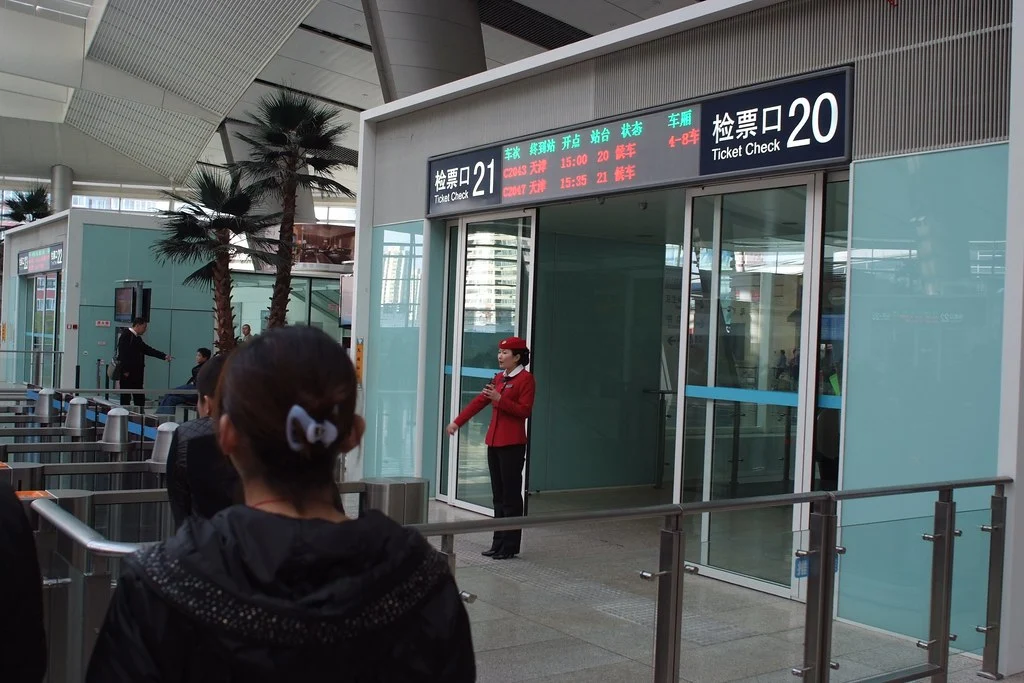 Using Automatic Contributions to Stay on Track atendant explaining how to use automatic ticket gate